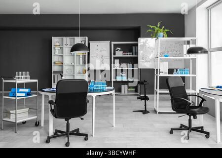 Interior of laboratory with desks and shelf units Stock Photo - Alamy