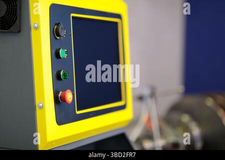 Touch screen control console of industrial automated equipment. Selective focus. Stock Photo