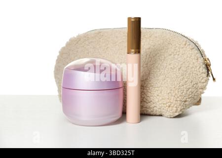 Cosmetic products and bag isolated on white Stock Photo