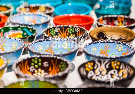 Hand painted ceramic plates on the table Stock Photo