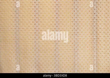 Beige anti-slip fabric with porous texture and breathable structure, textile background close-up Stock Photo