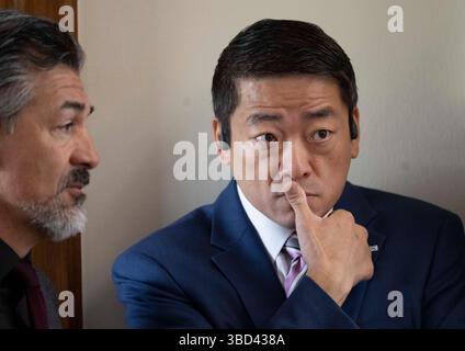 Texas state Rep. Gene Wu speaks to media outside the house chambers at