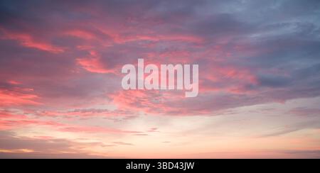 Pink Clouds at Sunset: Sky Beauty. Stock Photo