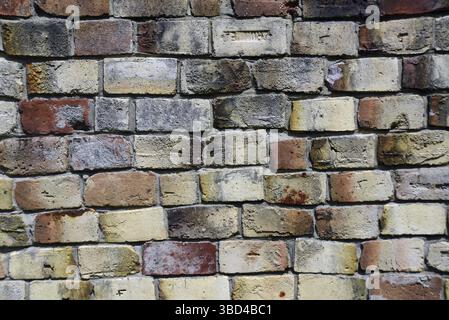 Old bricks on an historic building create a rustic textured background Stock Photo