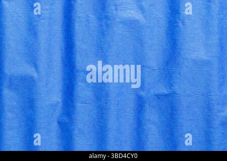 Blue crepe tissue craft paper background backdrop. Craft hobby material concept. Stock Photo