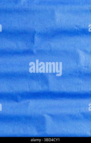 Blue crepe tissue craft paper background backdrop. Craft hobby material concept. Stock Photo