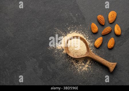 Ground dried almonds in a spoon - Prunus dulcis Stock Photo