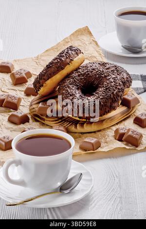 Chocolate donuts and coffee on white wooden background Stock Photo