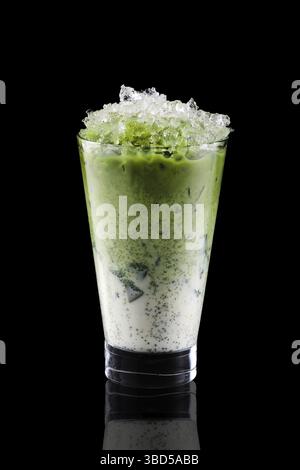 Iced matcha tea and crushed ice isolated on black background Stock Photo