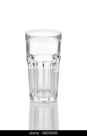 Empty transparent faceted glass with reflection on white background Stock Photo