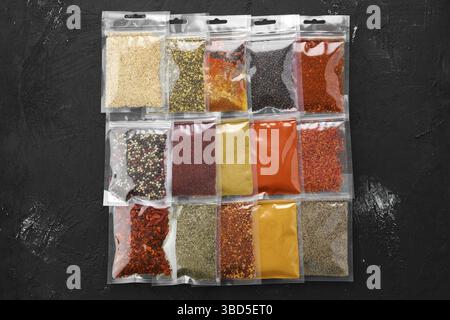 Overhead view of different spices in plastic package Stock Photo