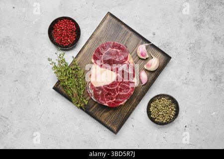 Top view of raw beef ossobuco on grey stone background Stock Photo