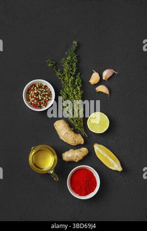 Composition with condiments on black background. All purpose spice Stock Photo