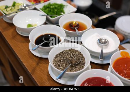 spice background, top view. seasoning in cups. Set of bowls with different spices and herbs, top view. High quality photo Stock Photo