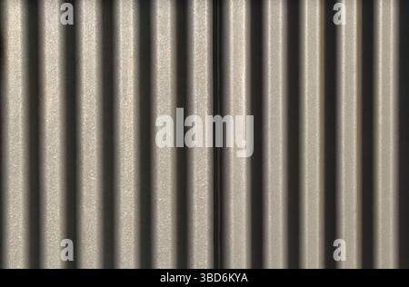 Close-up of a corrugated metal surface abstract textured background Stock Photo