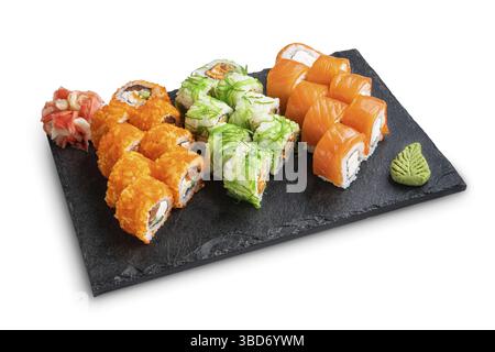 Big set of rolls with wasabi and pickled ginger on stone serving board isolated on white Stock Photo