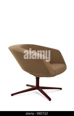 a modern armchair upholstered in brown fabric rests on a dark red metal base against a clean white background Stock Photo