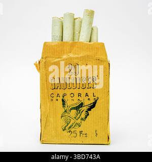 Old pack of Gauloises, typical french cigarettes on a white background,  cutout, France Stock Photo