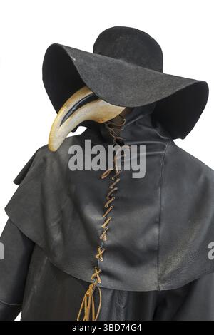 Black wide-brimmed hat, overcoat and beaked mask for plague doctor to ...