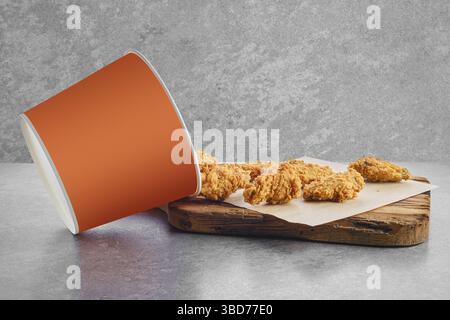 Deep fried chicken wings basket in breading scattered on parchment paper Stock Photo