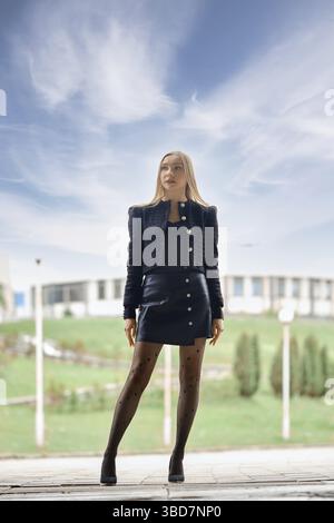 Full length urban portrait of confident woman outdoors Stock Photo