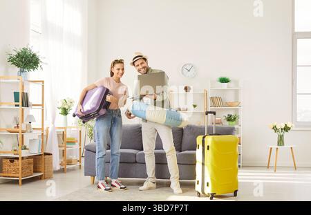 Young family looking for hot sale for summer vacation, booking tickets online for flight Stock Photo