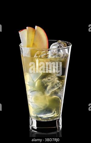 Glass of cold water with ice cubes and apple syrup isolated on black background Stock Photo