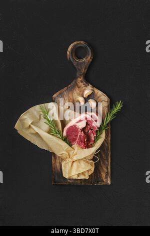 Raw fresh lamb double loin chop wrapped in paper Stock Photo
