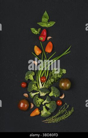 Overhead composition with fresh spring onion, tomato, broccoli, bell pepper, thyme, basil and garlic Stock Photo