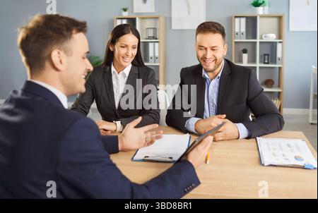 Coworkers Or Clients Having A Meeting And Working Together In An Office Stock Photo