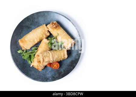 Crispy Spring Rolls on Ceramic Plate isolated on white background Stock Photo