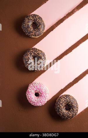 Abstract isolated donuts on pink background Stock Photo