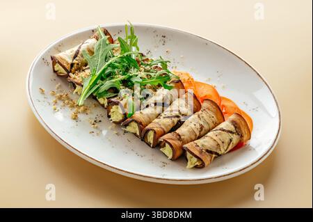 baked rolls with eggplant and herbs on a plate Stock Photo