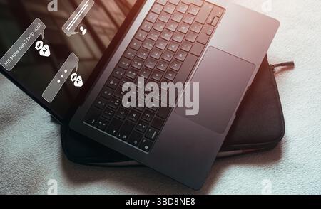 Laptop screen with chatbot on it. Robot application for conversation assist. AI Artificial Intelligence concept Stock Photo