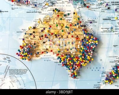 world map isolated on south america australia with multi coloured pins Stock Photo