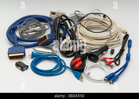 A collection of older and newer computer, aerial and telecoms cables and connectors. Stock Photo