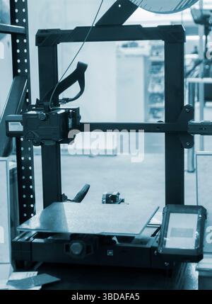 Empty working surface of 3D printer. 3D printer not working. Desktop 3D printer without printing process. Stock Photo