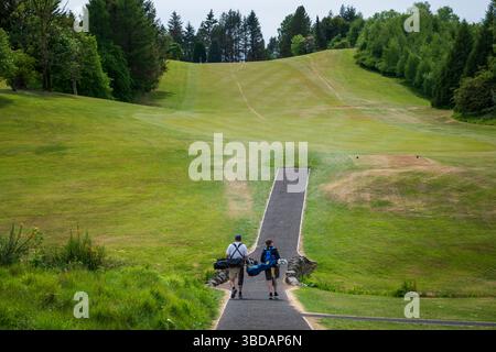 Father and Son golfing on Whitecraigs Golf Club, club house, Newton Mearns, Glasgow, Scotland Stock Photo