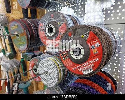Assorted grinding discs displayed in hardware store. Stock Photo
