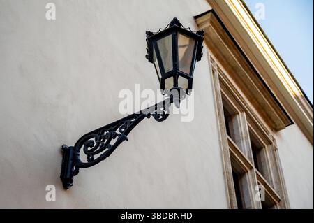 Black Wall Lamp on Exterior Building Facade in Poland Stock Photo