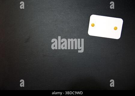 Black slate with white field for notes Blackboard (slate) with blank, writable notepad Stock Photo