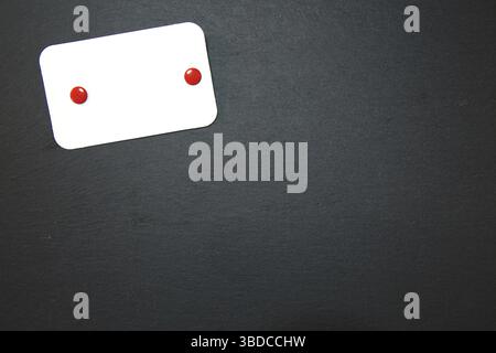 Black slate with white field for notes Blackboard (slate) with blank, writable notepad Stock Photo