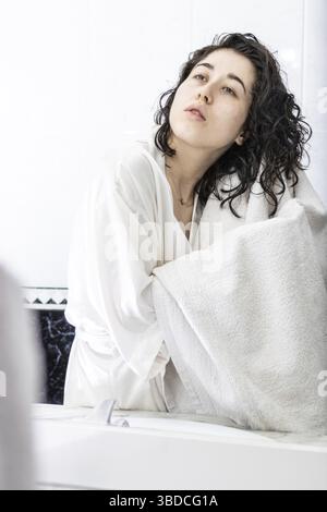 Beautiful woman drying hair with towel in bathroom Stock Photo - Alamy