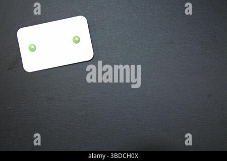 Black slate with white field for notes Blackboard (slate) with blank, writable notepad Stock Photo