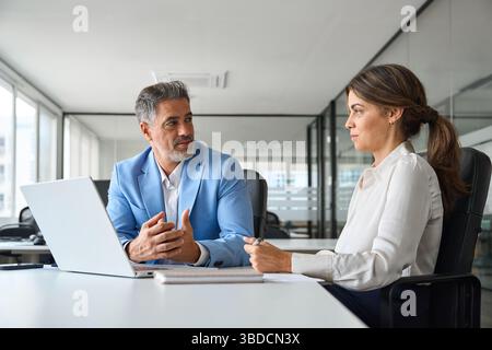 Two busy professional executive team business people working together. Stock Photo