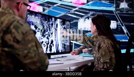 Technology Center Officer Analyzing Military Data On Army Computer System. Stock Photo