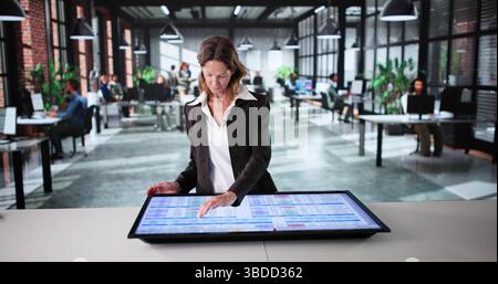 Female Accountant Analyzing Medical Data On Electronic Spreadsheet In Office Stock Photo