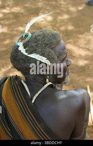 Toposa man with feathers in his hair, Nyanyagachor, Sudan, Toposa man with feathers in his hair, Nyanyagachor, Sudan Stock Photo