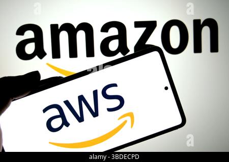 In this photo illustration, an AWS(Amazon web service) logo is seen displayed on a smartphone with an Amazon logo in the background. (Photo by Avishek Das / SOPA Images/Sipa USA) *** Strictly for editorial news purposes only *** Stock Photo