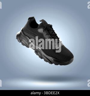 Fashionable black sneaker in air on blue grey gradient background Stock Photo